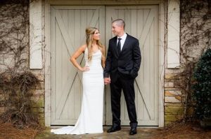Casey wed front of barn w jeff